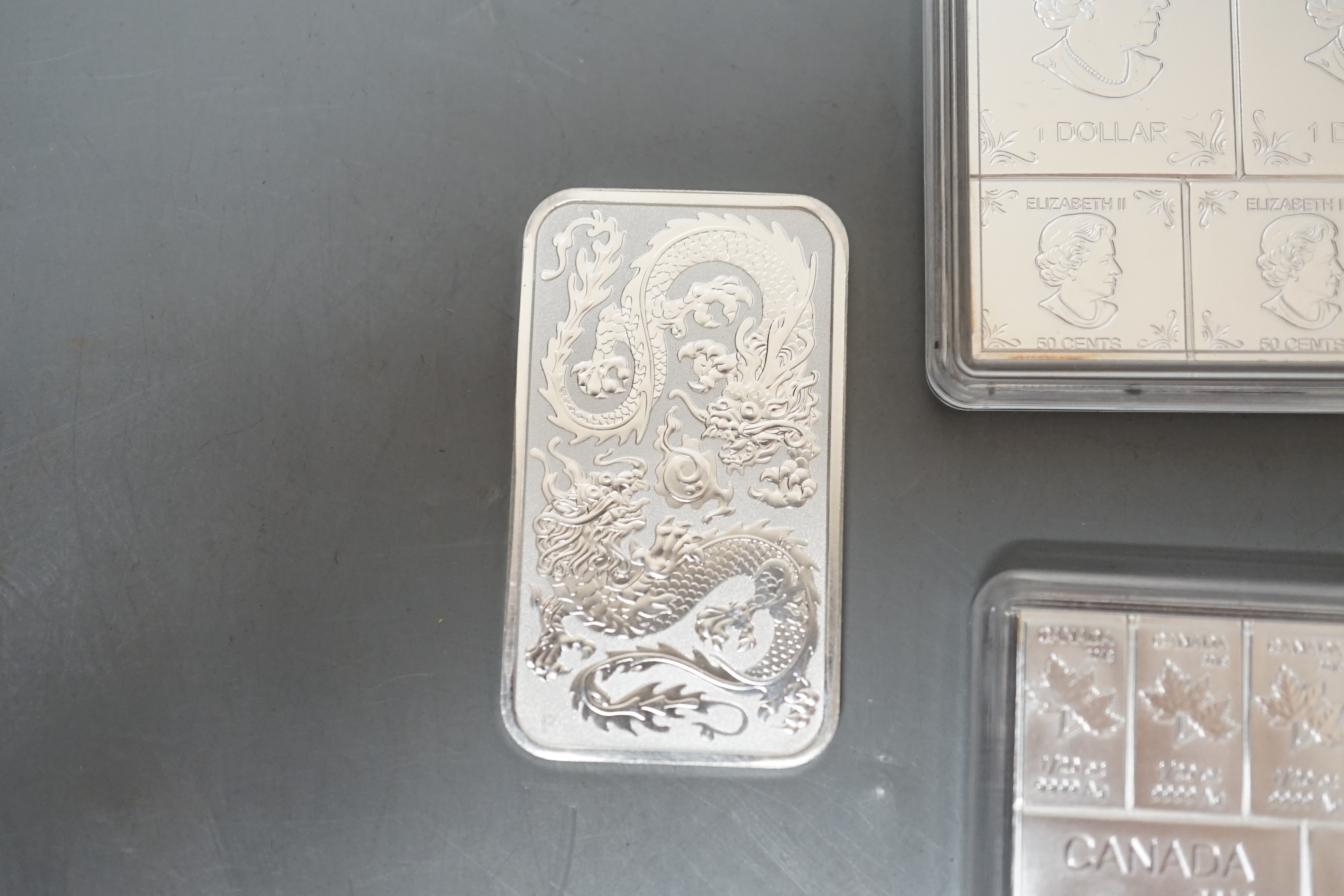 Three Canada 2018 2oz silver bullion ingots and an Australian 1oz. one dollar ingot